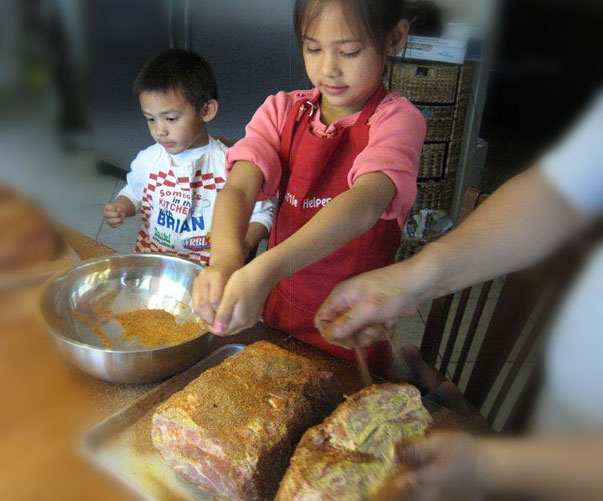 adding the rub to bbq meat