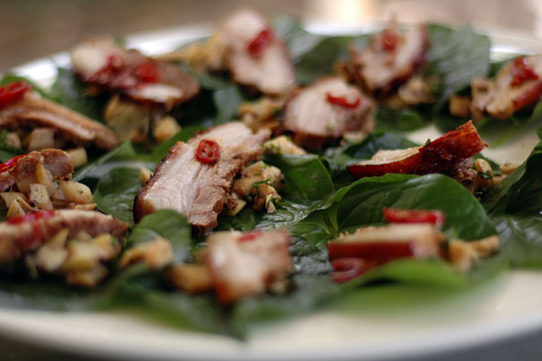 Pork belly with bamboo salad on a betel leaf