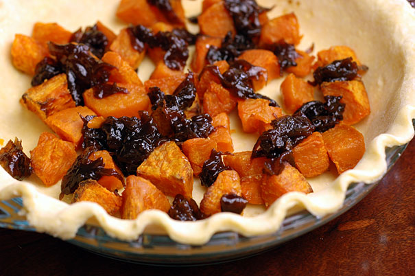 making a sweet potato and caramelized onion quiche