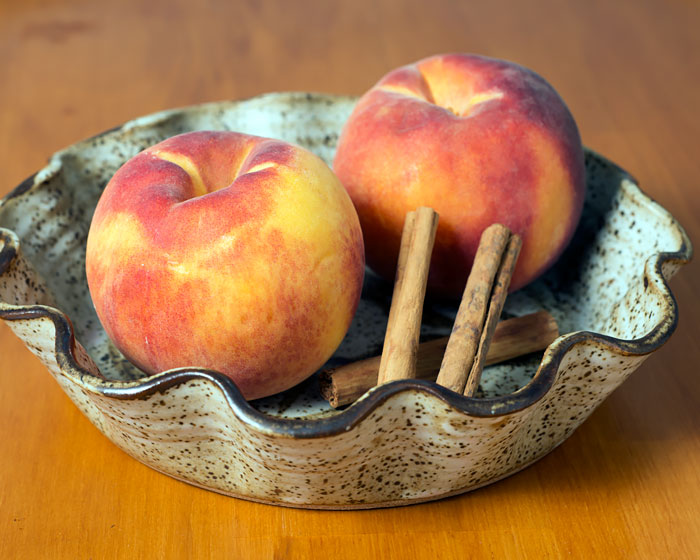 Peaches and cinnamon sticks